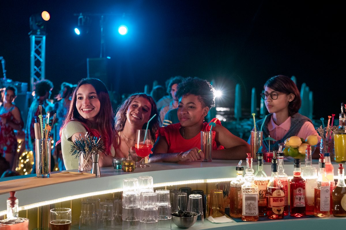 Summertime. (L to R) Ludovica Ciaschetti as Viviana, Amanda Campana as Sofia, Alice Ann Edogamhe as Blue, Andrea Butera as Alfredo in episode 303 of Summertime. Cr. Stefania Rosini/Netflix © 2022